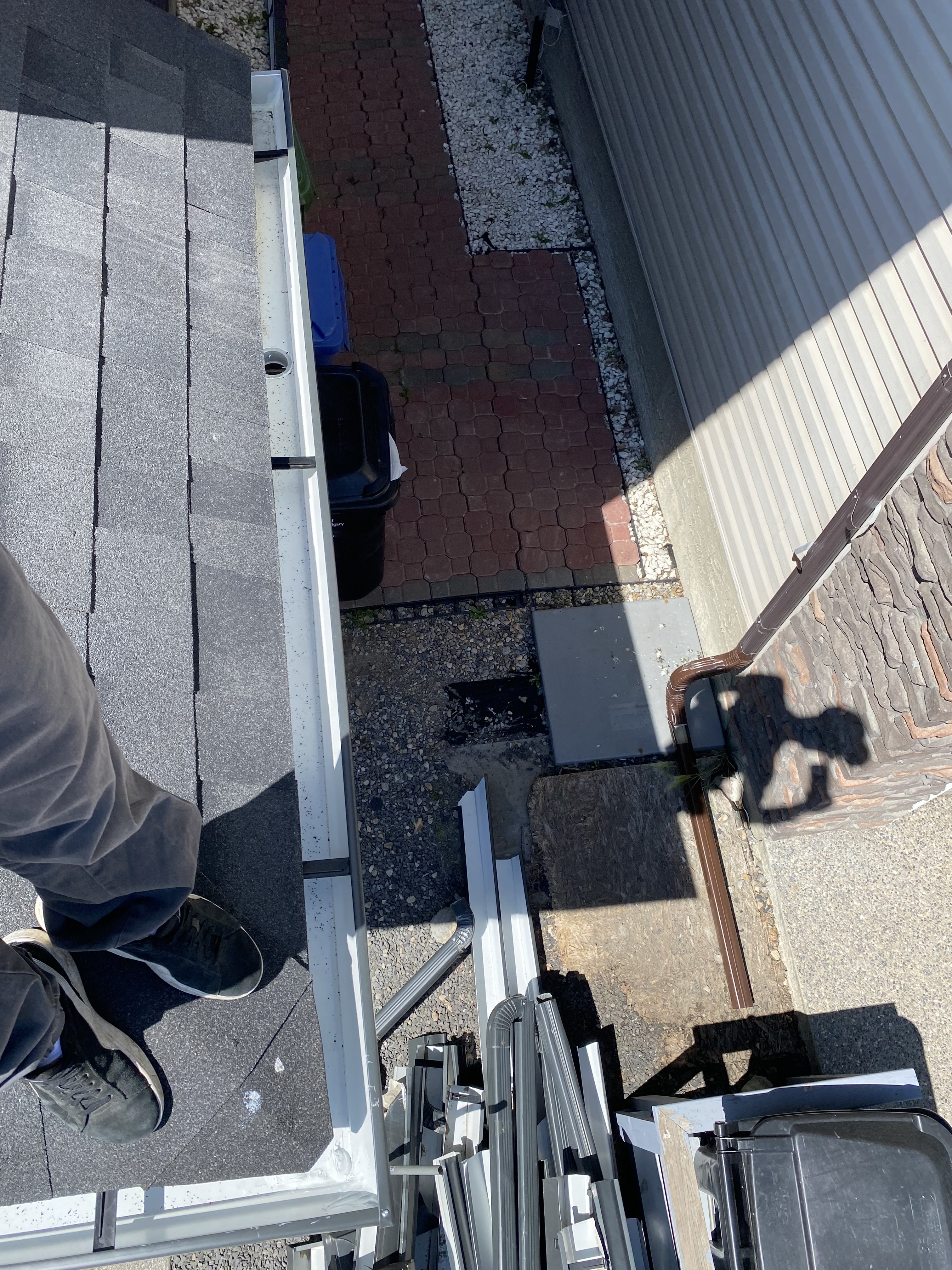 Eavestrough rooftop installation in progress on a Calgary home