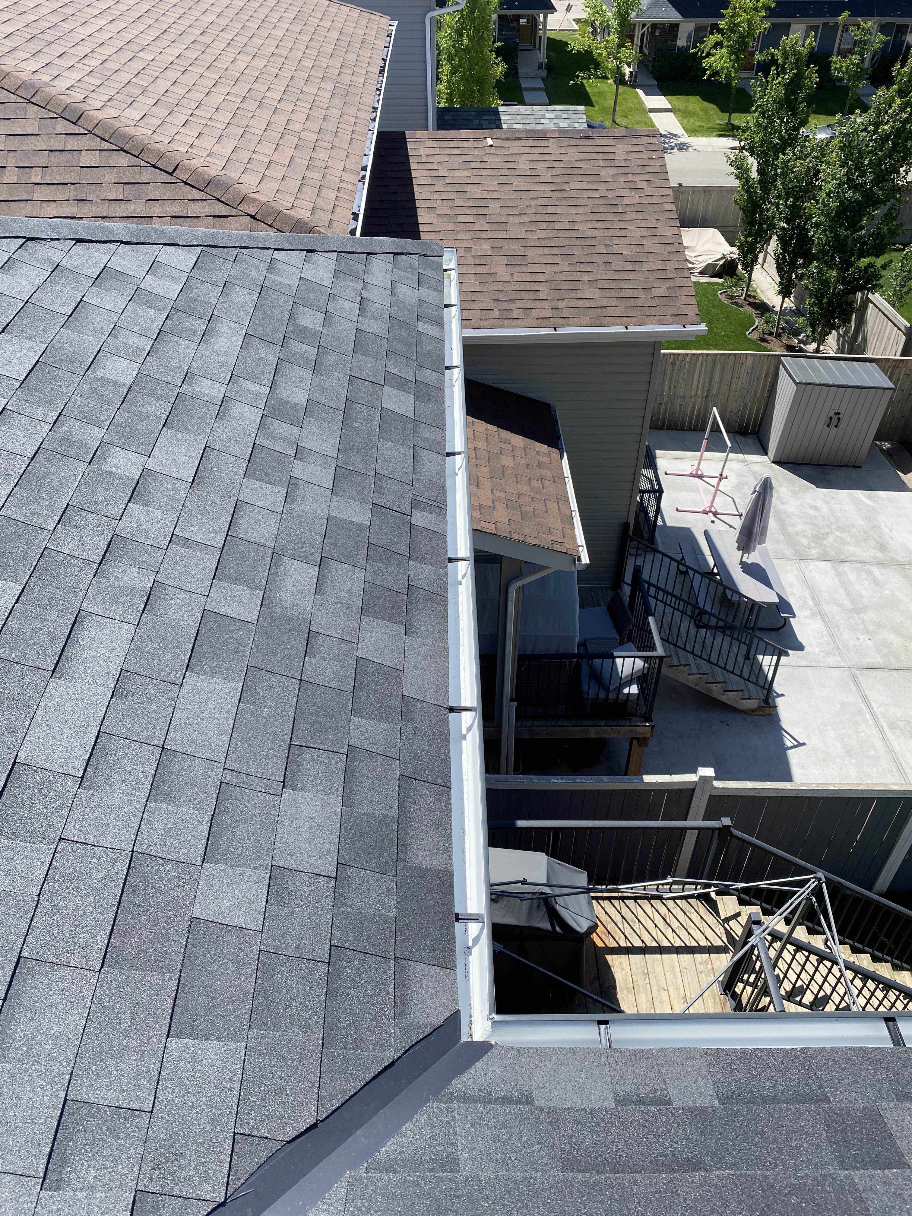 Eavestrough at roof valley above a balcony