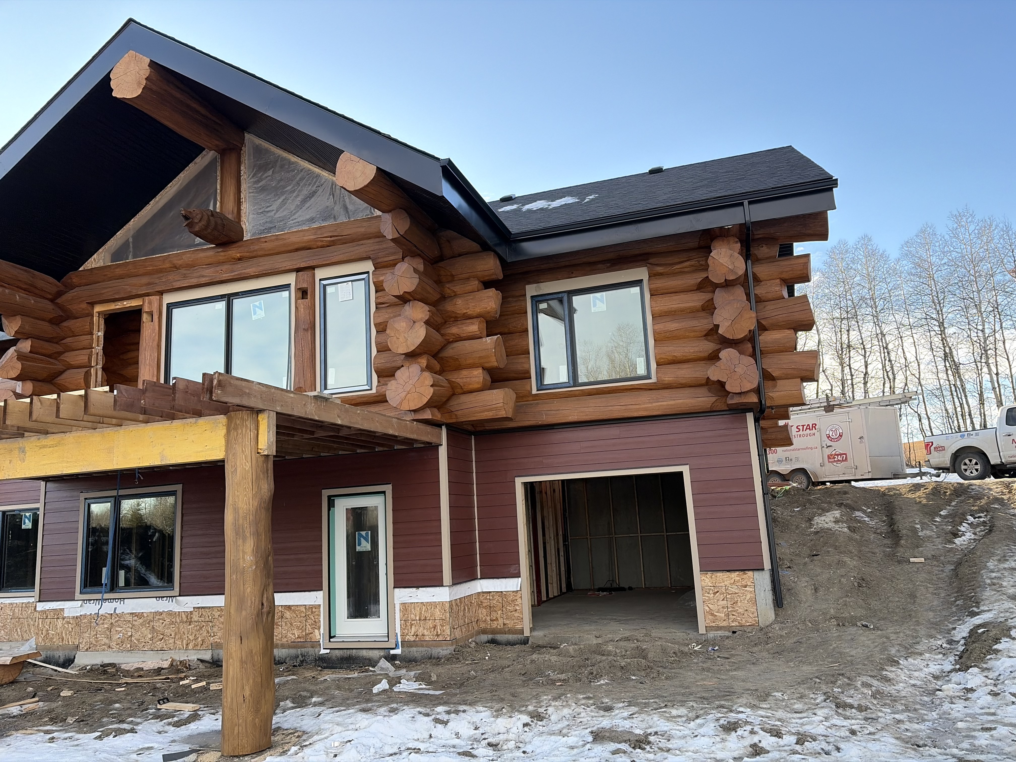 Log home front entrance with mountain view