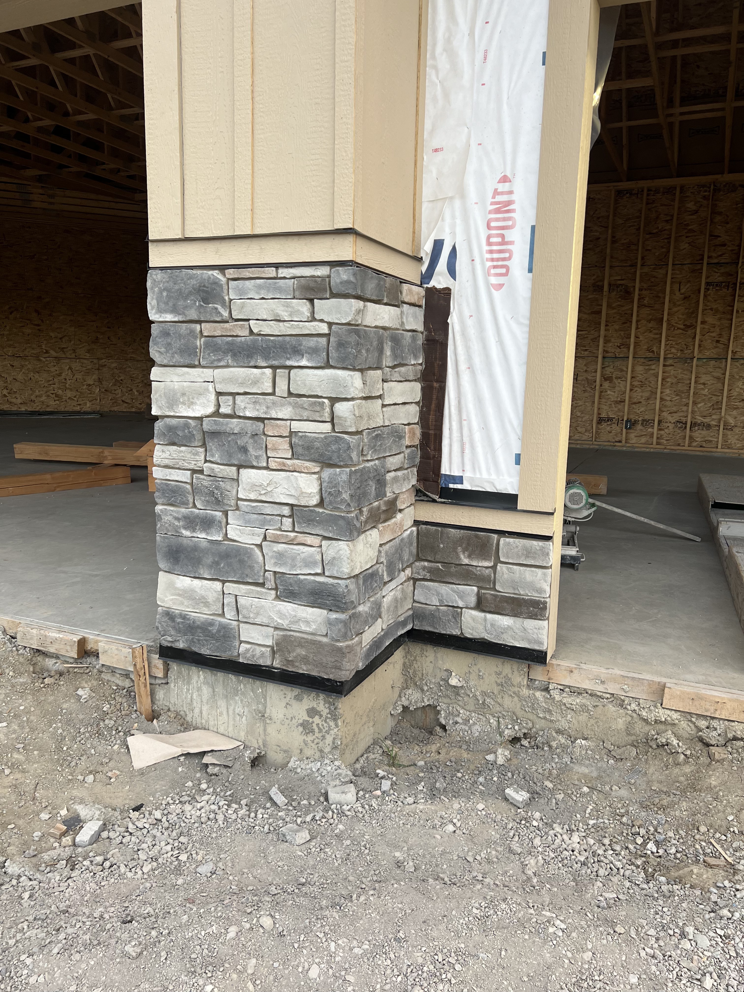 Stacked stone column and wainscot detail