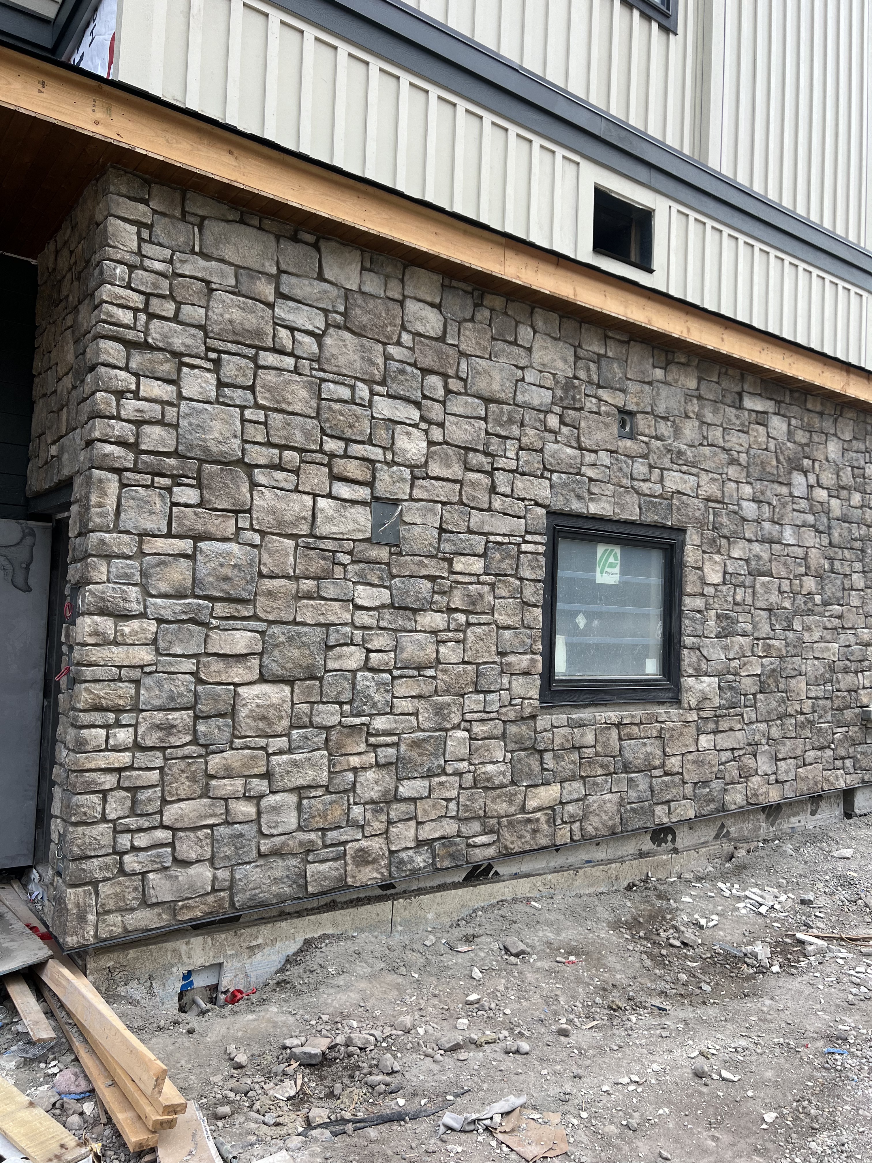 Full wall tumbled stone installation